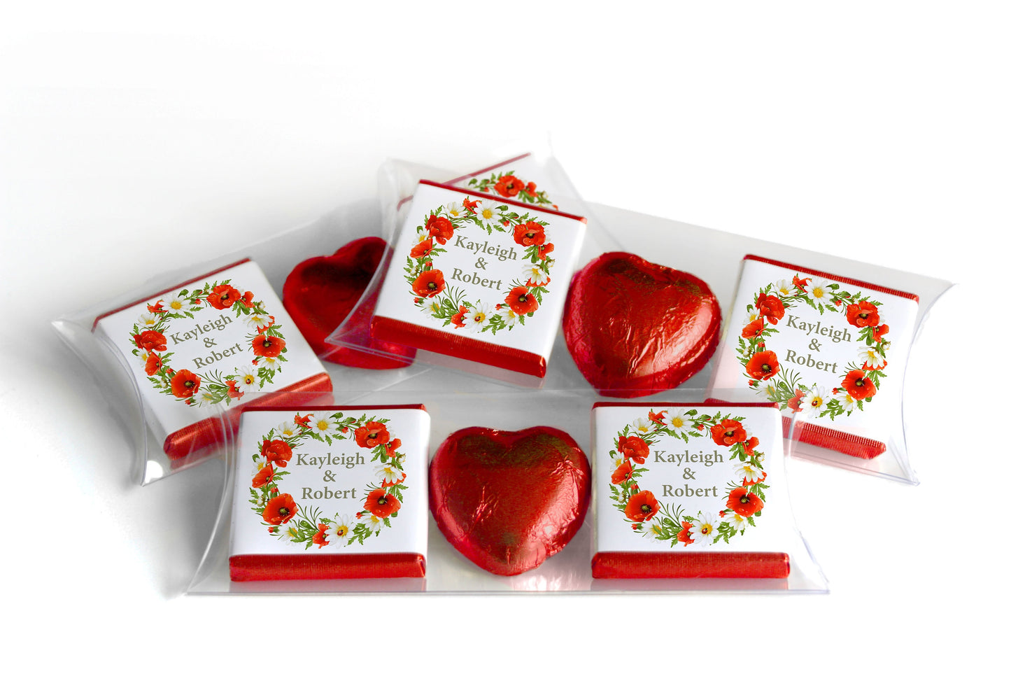 Elegant wedding favor set with floral-themed personalized chocolate wrappers and red foil heart chocolates