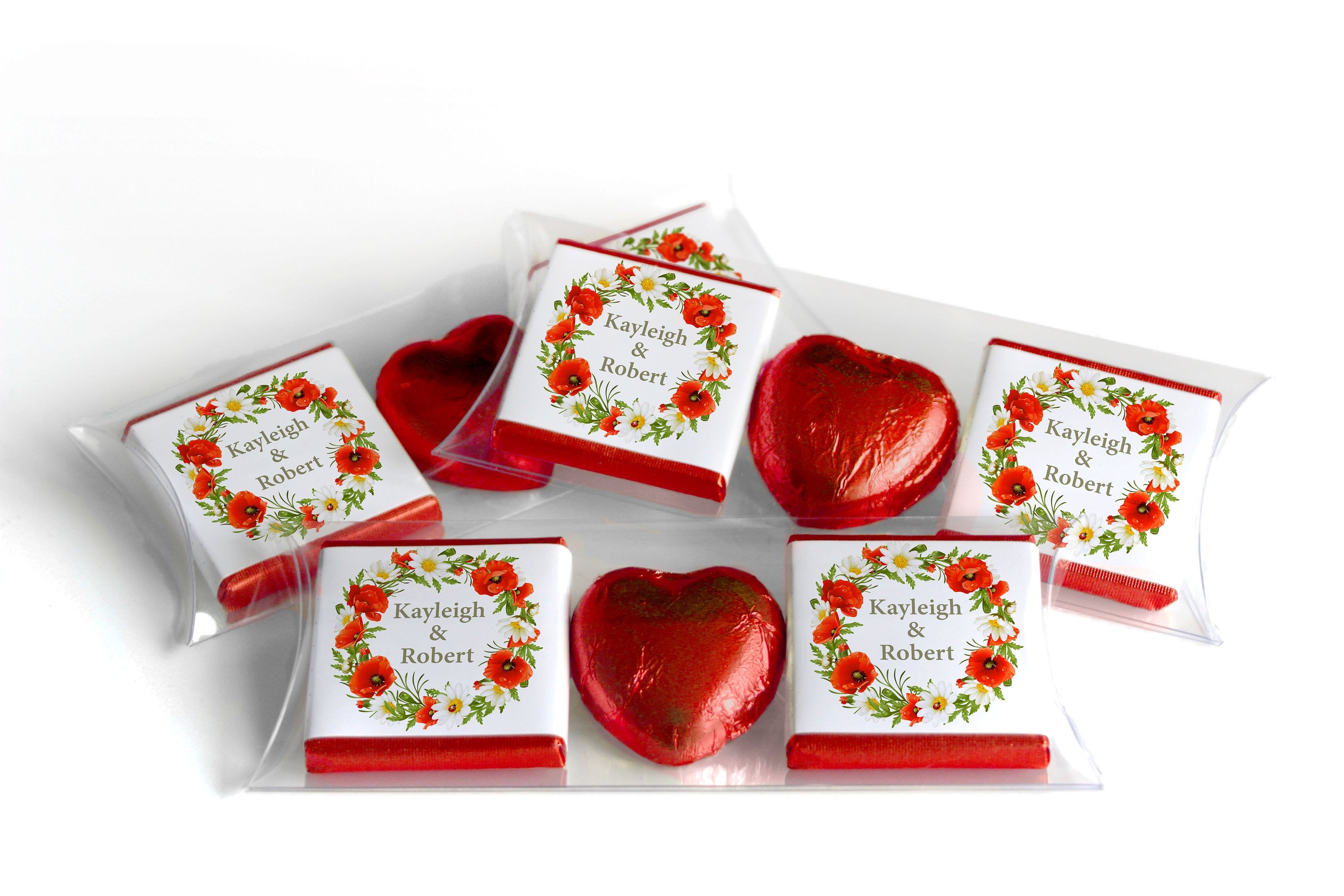 Elegant wedding favor set with floral-themed personalized chocolate wrappers and red foil heart chocolates